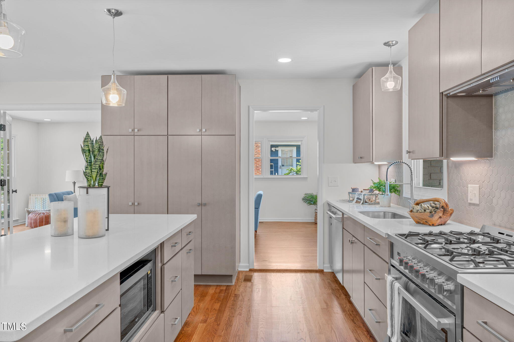 612 Delany Drive Raleigh, NC 27610 - Photo 11 of 45 a kitchen with stainless steel appliances granite countertop a sink stove and refrigerator