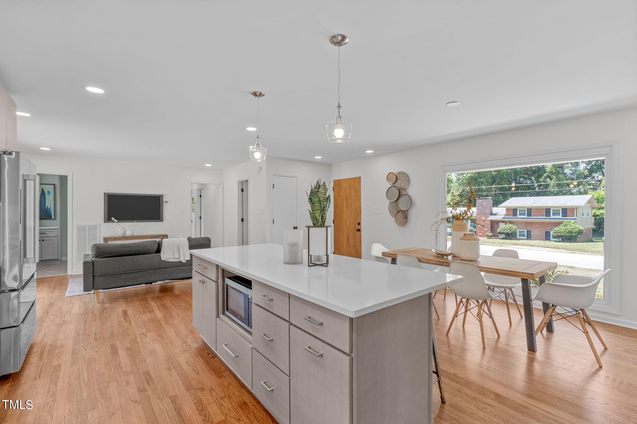 612 Delany Drive Raleigh, NC 27610 - Photo 14 of 45 a large kitchen with a large window and stainless steel appliances