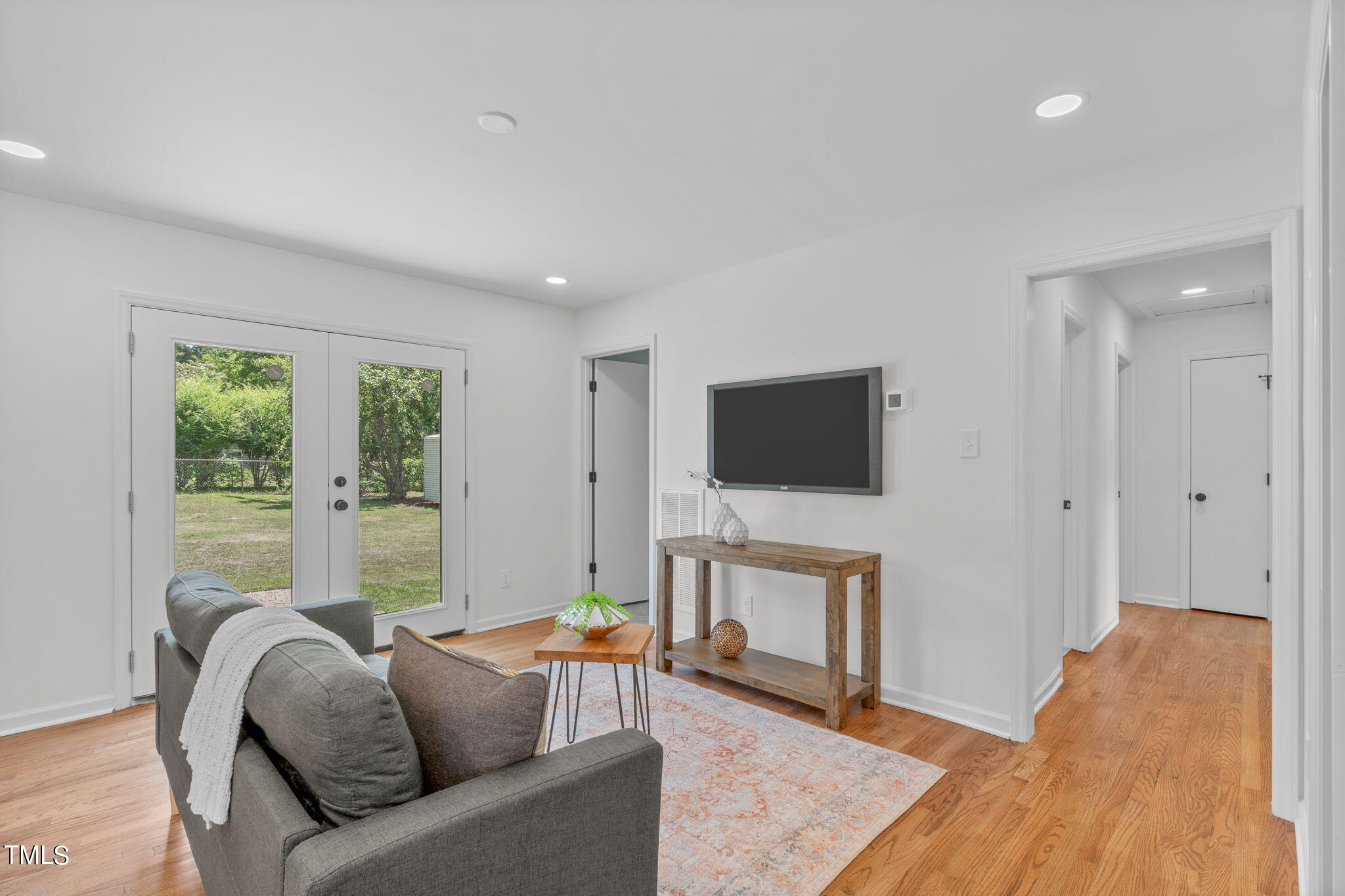 612 Delany Drive Raleigh, NC 27610 - Photo 15 of 45 a living room with furniture and a flat screen tv