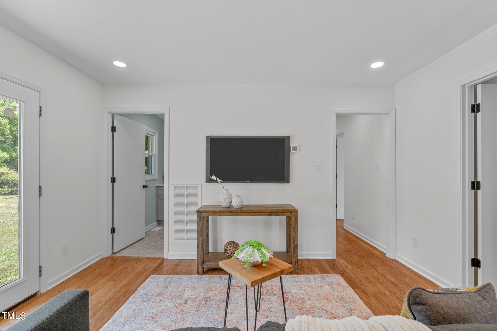 612 Delany Drive Raleigh, NC 27610 - Photo 16 of 45 a living room with furniture and a flat screen tv