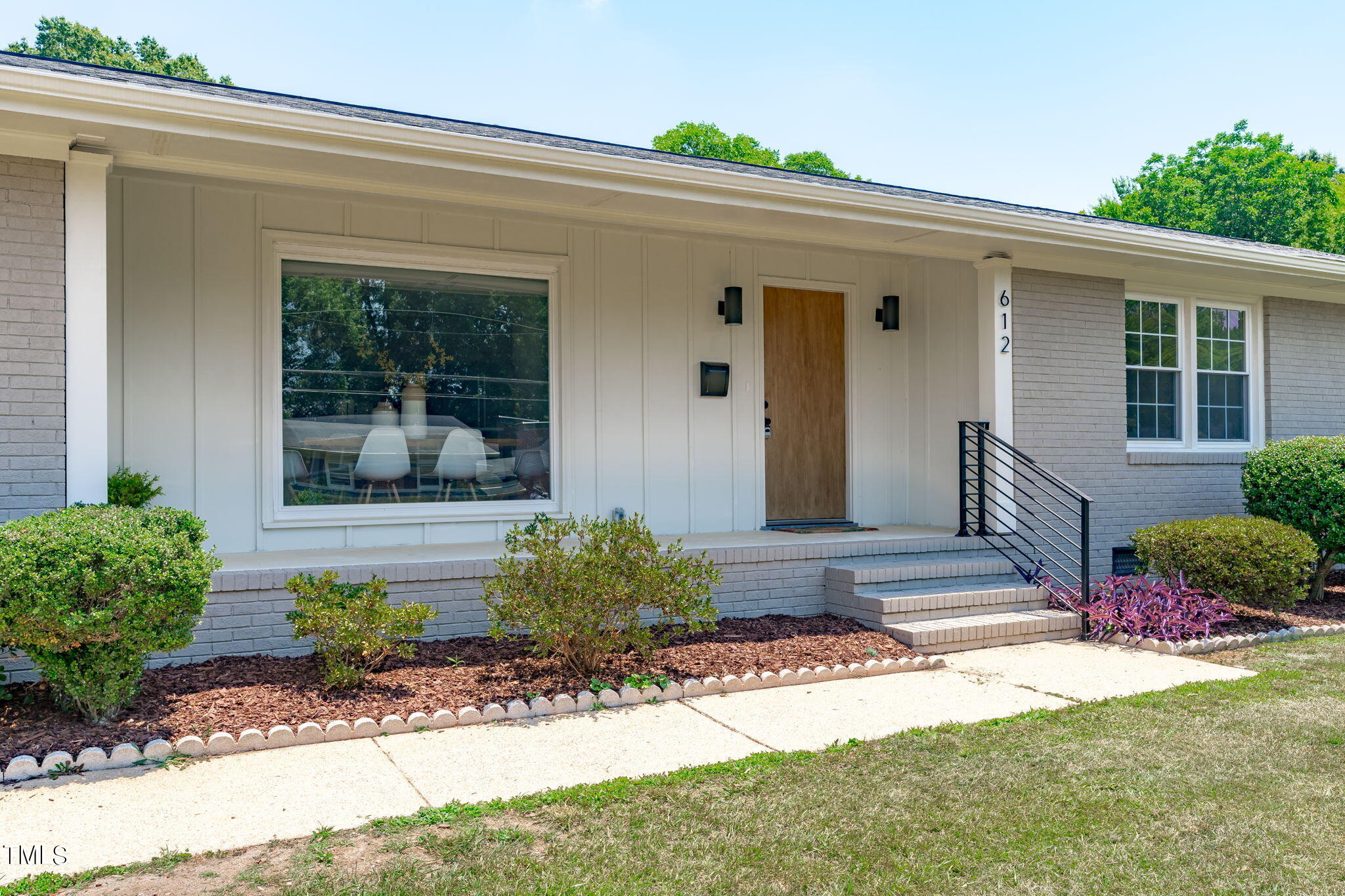 612 Delany Drive Raleigh, NC 27610 - Photo 2 of 45 a front view of a house with garden