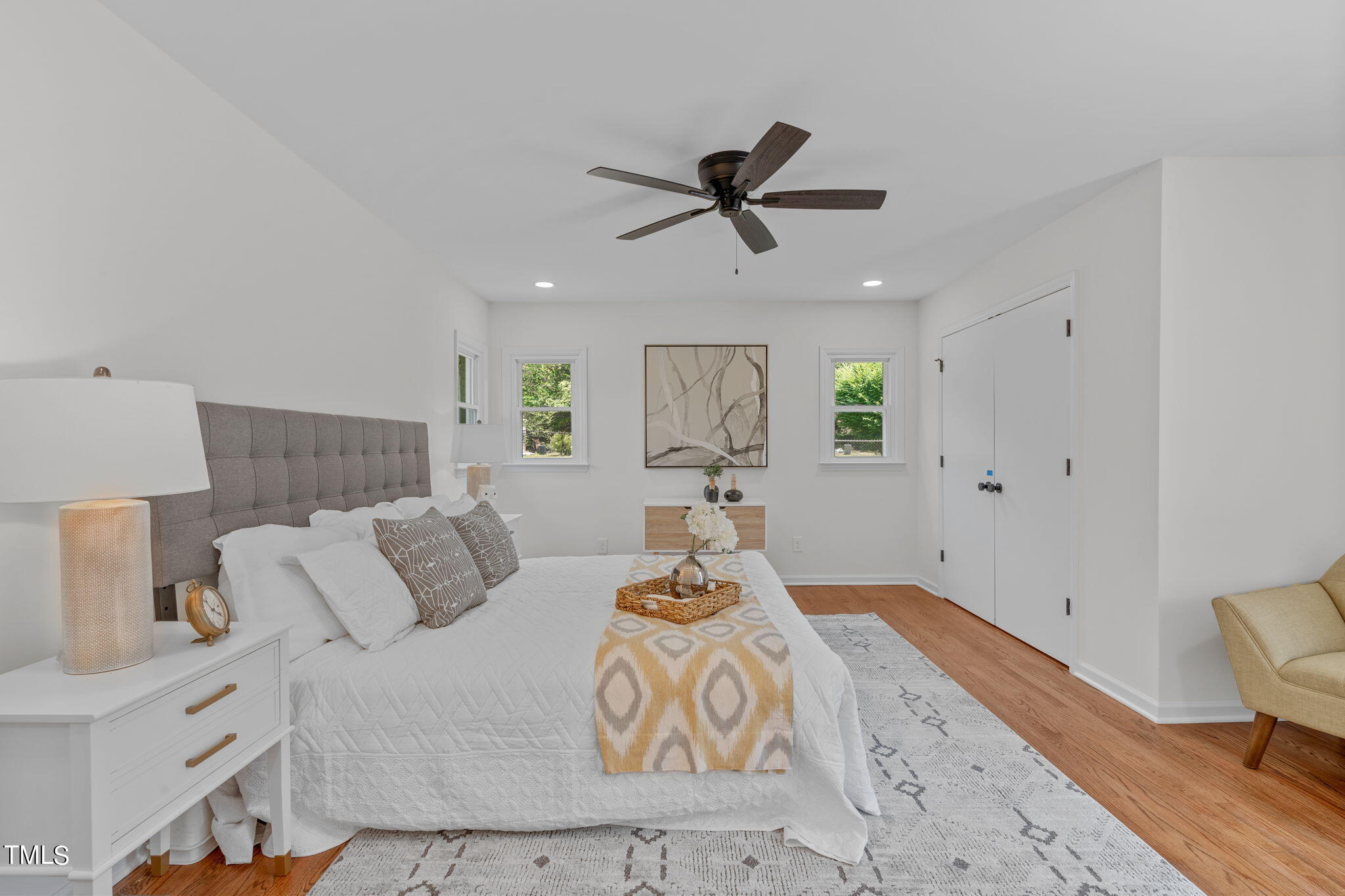 612 Delany Drive Raleigh, NC 27610 - Photo 27 of 45 a bedroom with a bed and wooden floor