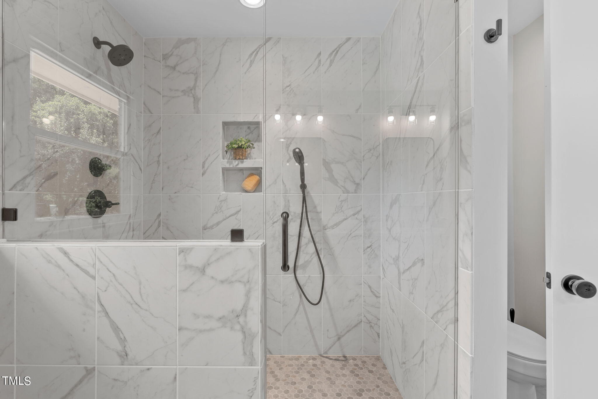 612 Delany Drive Raleigh, NC 27610 - Photo 31 of 45 a bathroom with a shower