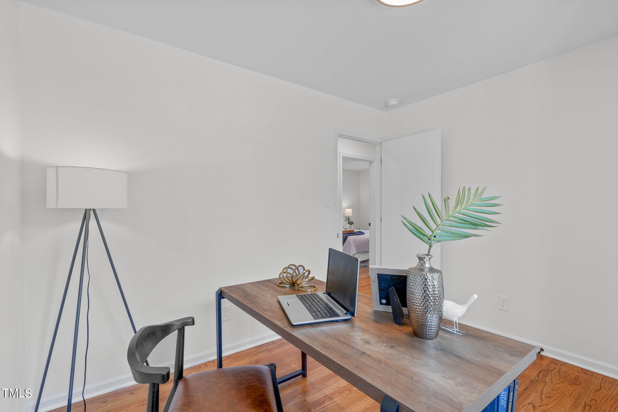 612 Delany Drive Raleigh, NC 27610 - Photo 33 of 45 a view of a workspace with furniture and wooden floor