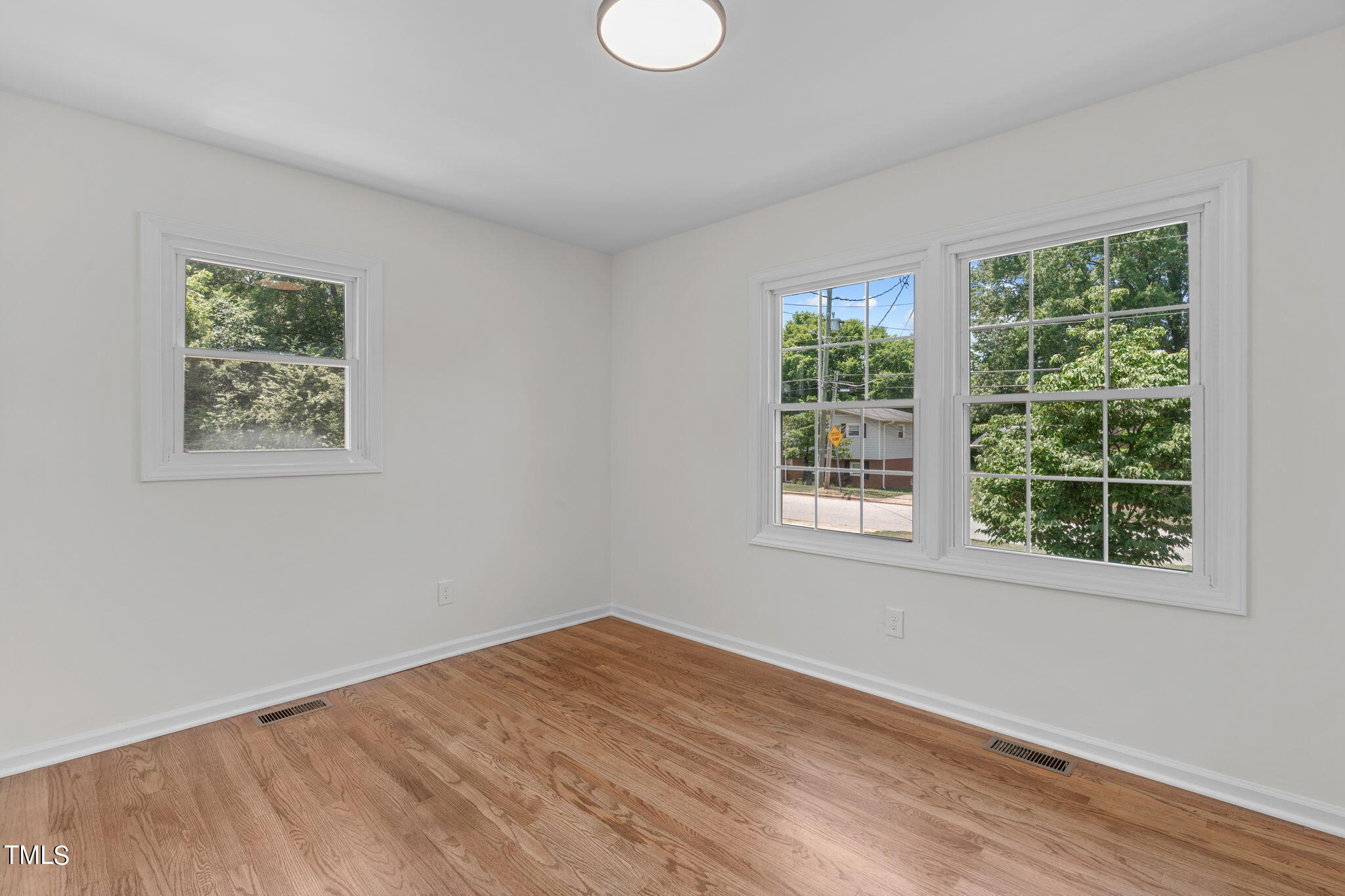 612 Delany Drive Raleigh, NC 27610 - Photo 35 of 45 a view of empty room with wooden floor and fan