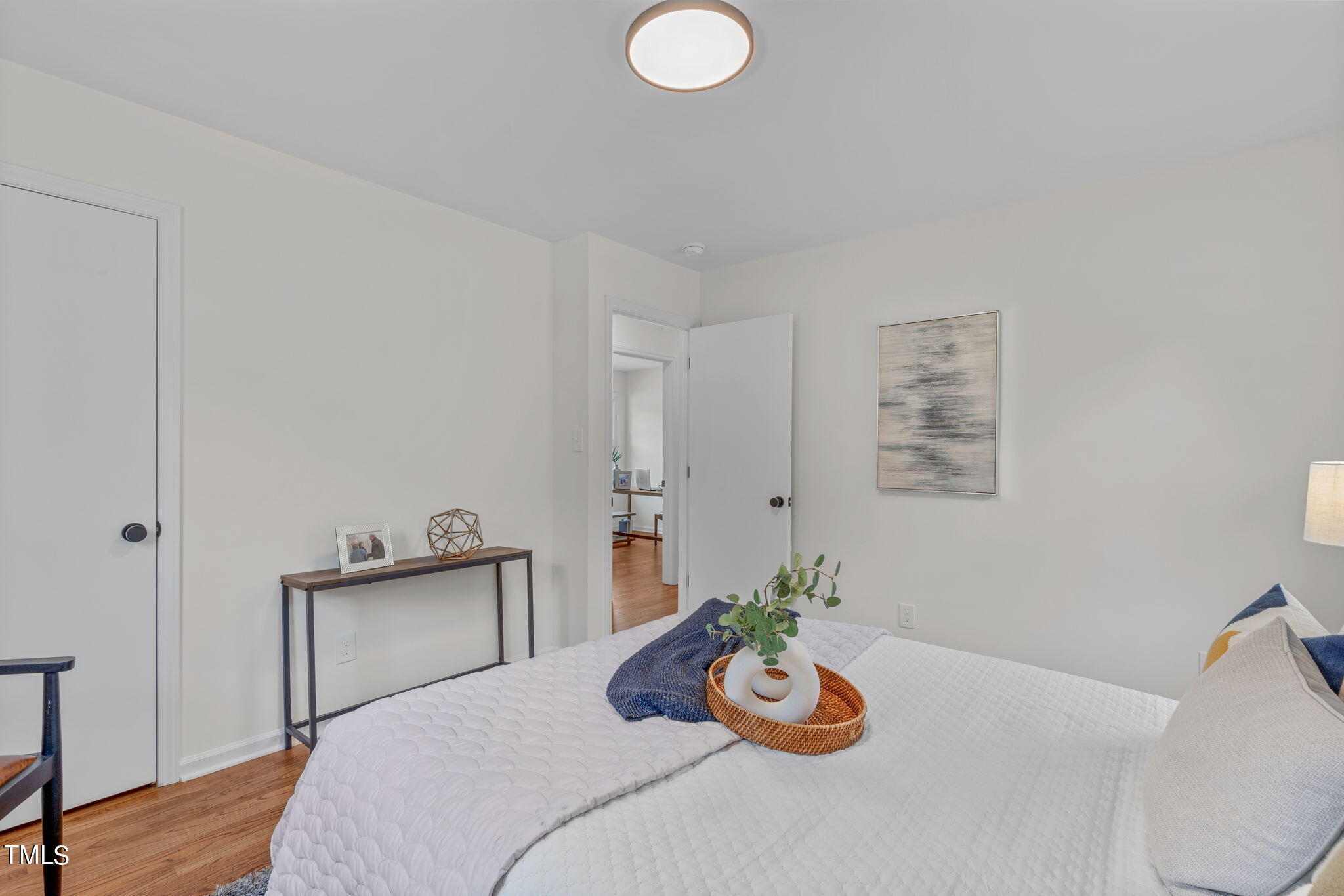 612 Delany Drive Raleigh, NC 27610 - Photo 38 of 45 a bedroom with furniture and a potted plant