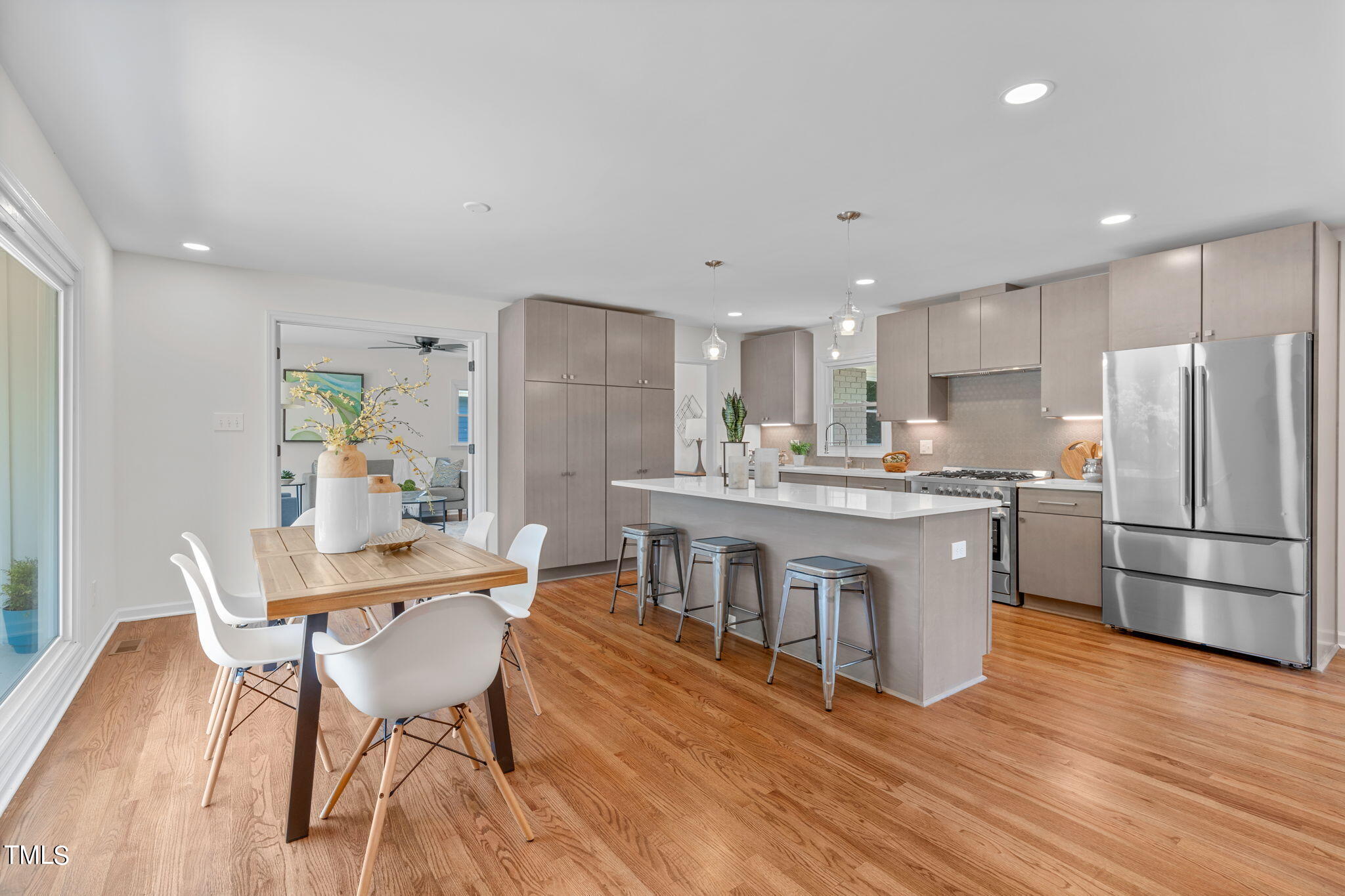 612 Delany Drive Raleigh, NC 27610 - Photo 5 of 45 a kitchen with stainless steel appliances kitchen island granite countertop a kitchen island hardwood floor and a sink