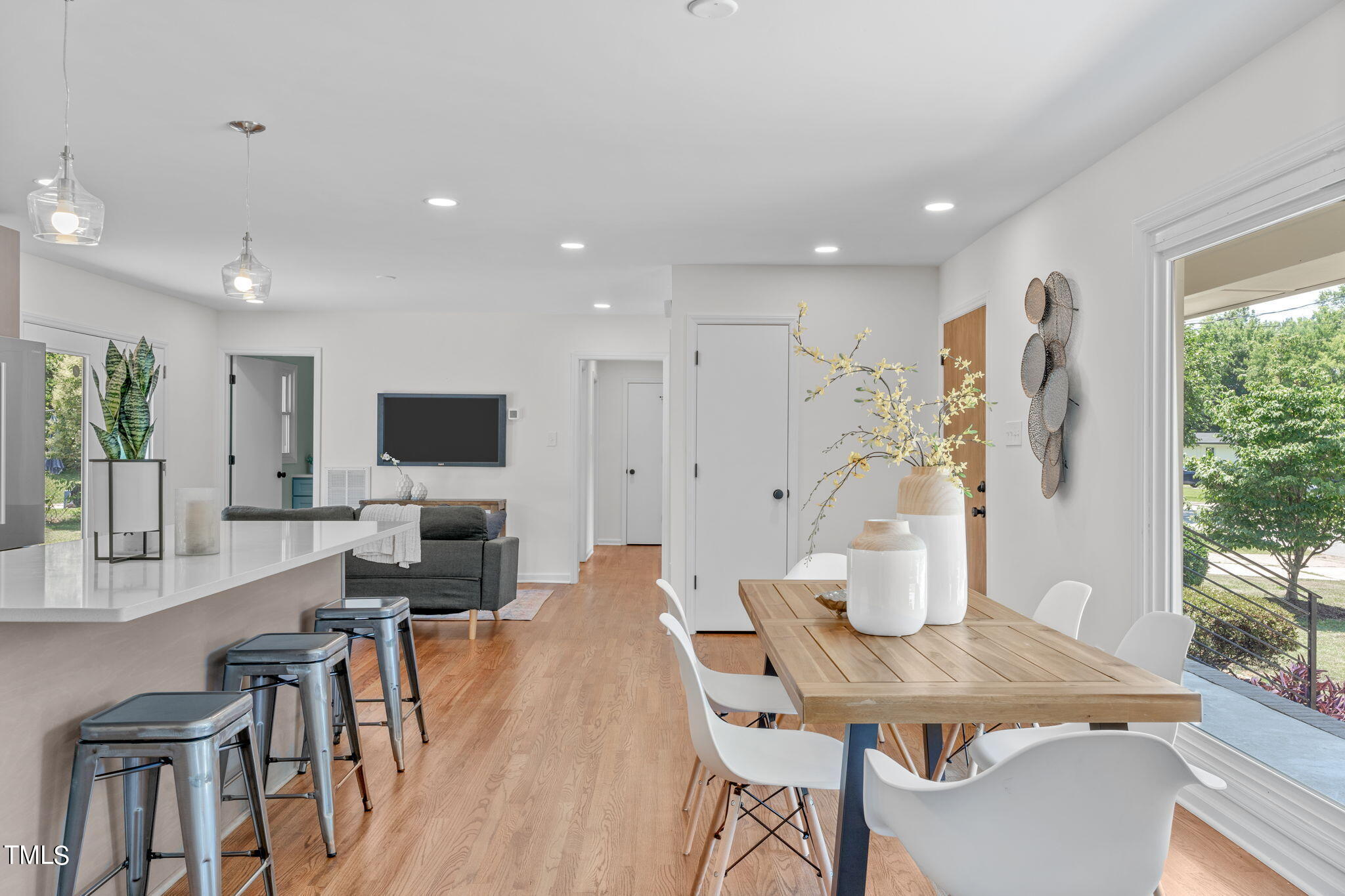 612 Delany Drive Raleigh, NC 27610 - Photo 7 of 45 a living room with furniture a flat screen tv and a large window