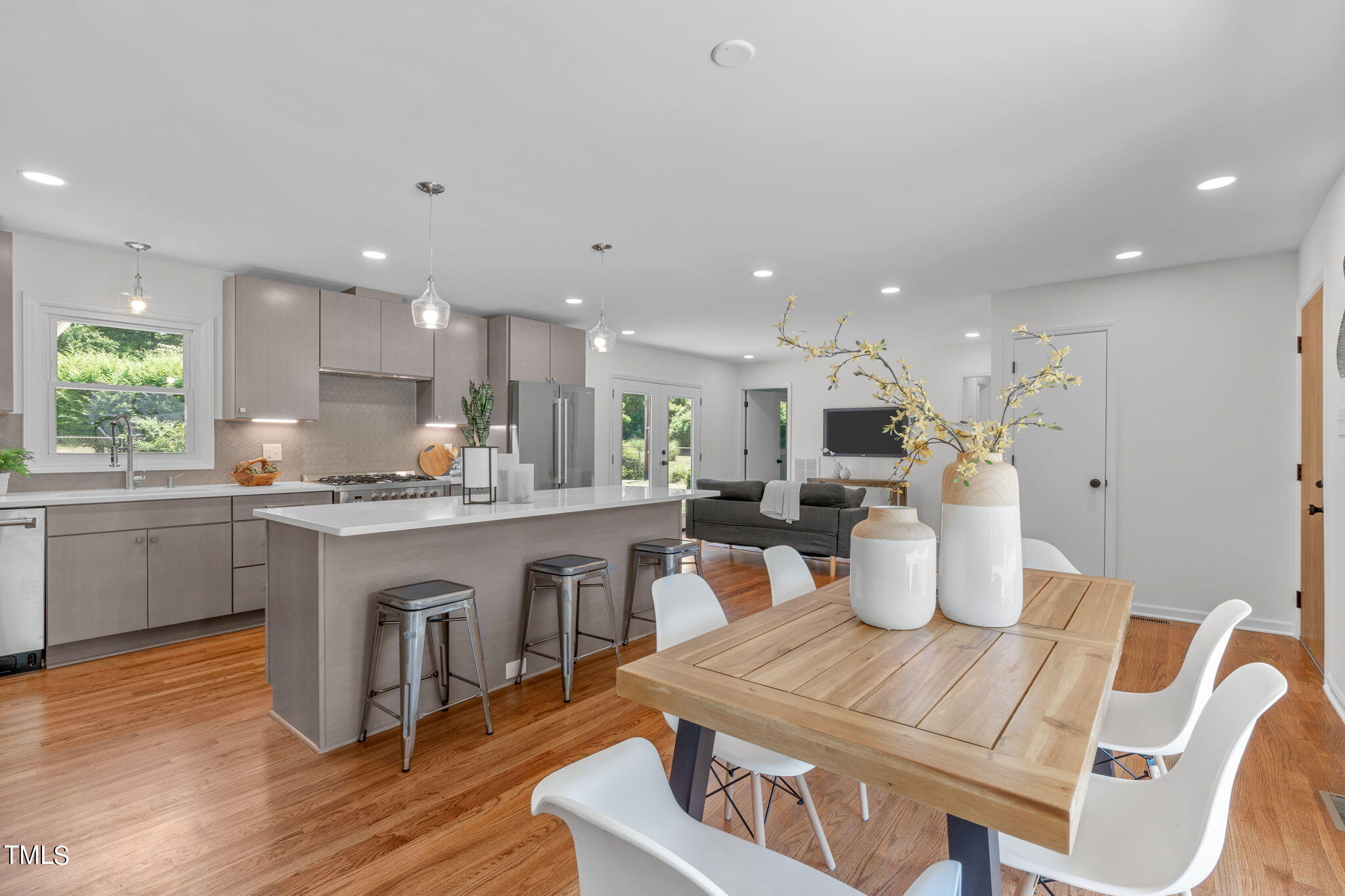 612 Delany Drive Raleigh, NC 27610 - Photo 8 of 45 a open dining room with stainless steel appliances furniture a window and a kitchen view