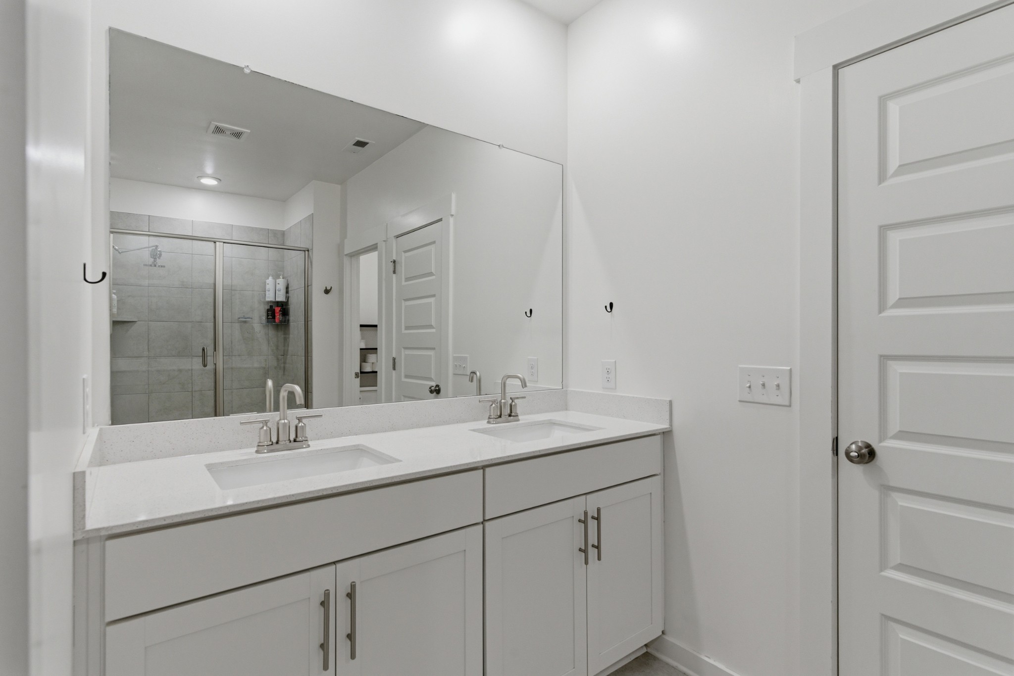 165 Harvest Point Boulevard Spring Hill, TN 37174 - Photo 15 of 28 a bathroom with a shower sink vanity and mirror