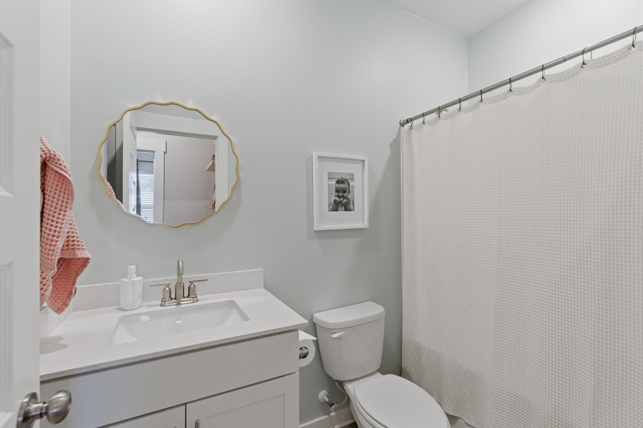 165 Harvest Point Boulevard Spring Hill, TN 37174 - Photo 19 of 28 a bathroom with a toilet a sink and mirror