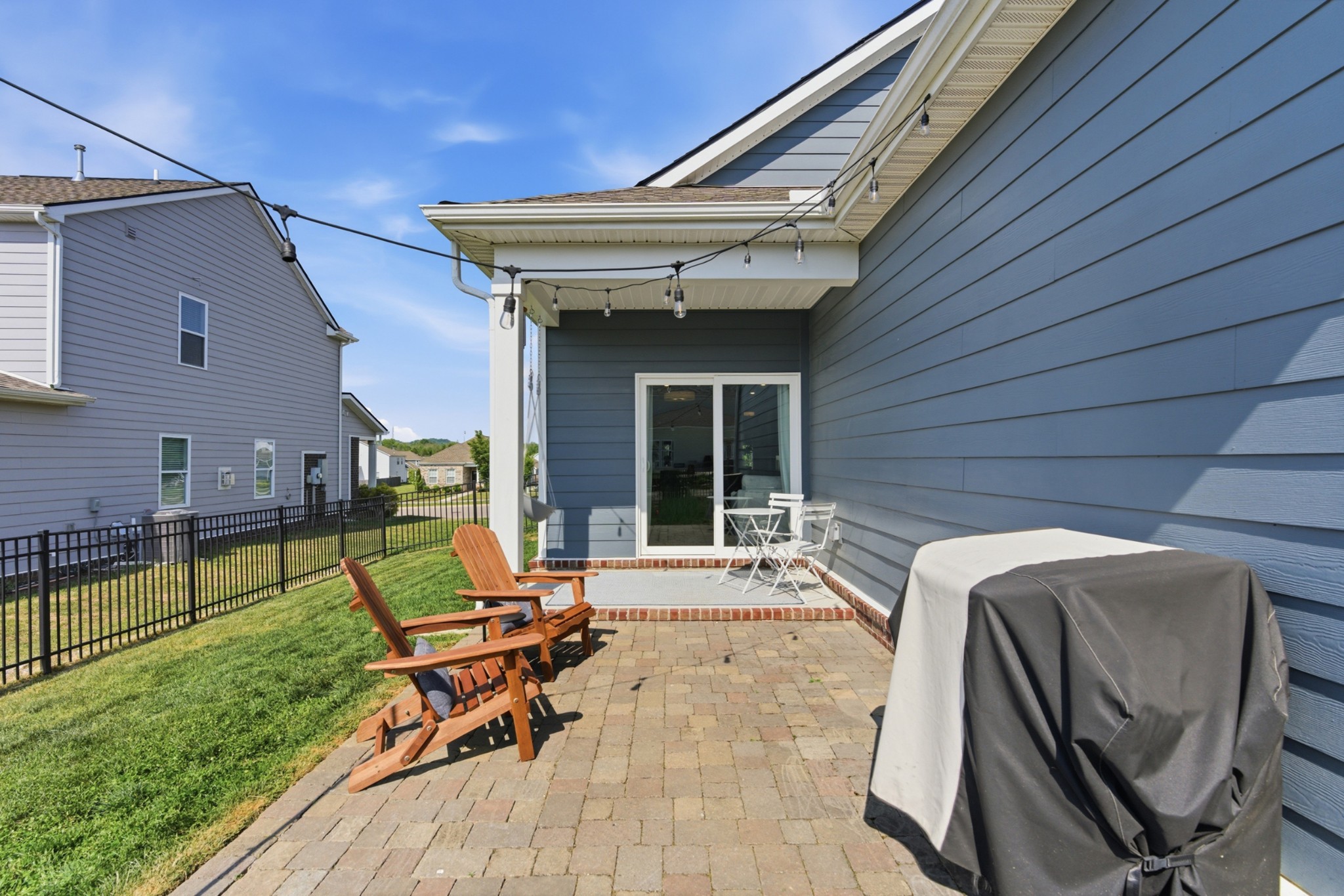 165 Harvest Point Boulevard Spring Hill, TN 37174 - Photo 26 of 28 a view of a house with backyard sitting area and garden