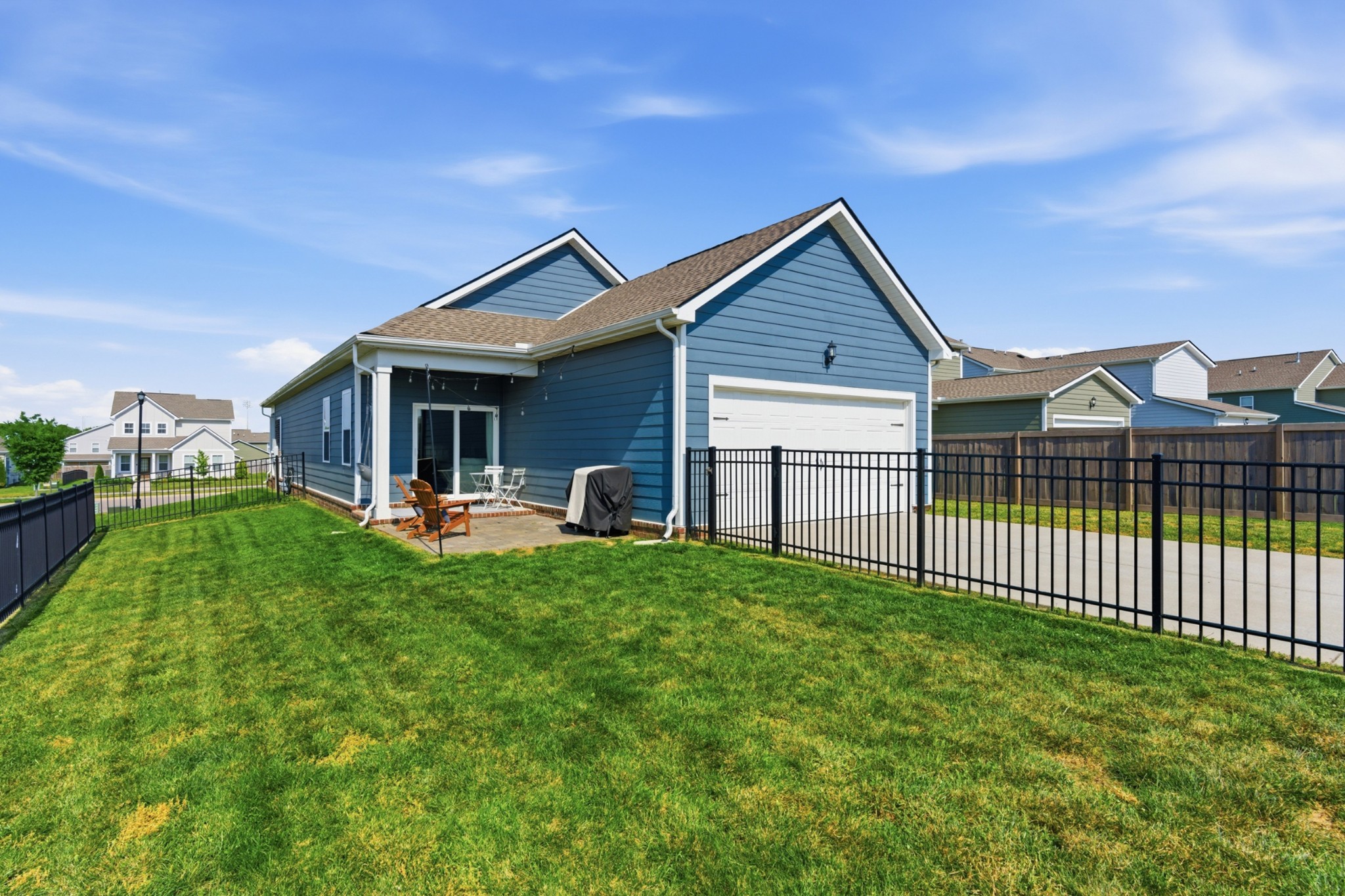 165 Harvest Point Boulevard Spring Hill, TN 37174 - Photo 27 of 28 a view of a house with backyard and porch