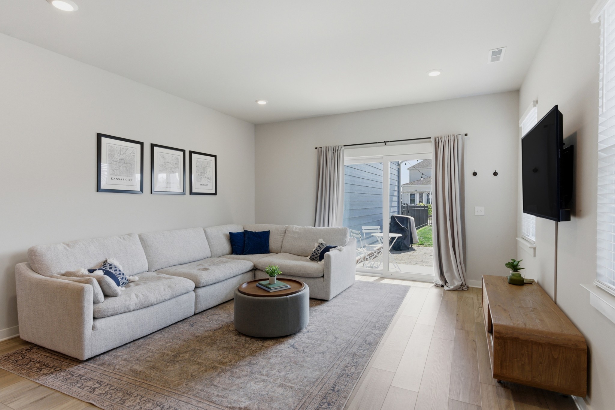 165 Harvest Point Boulevard Spring Hill, TN 37174 - Photo 6 of 28 a living room with furniture and a flat screen tv