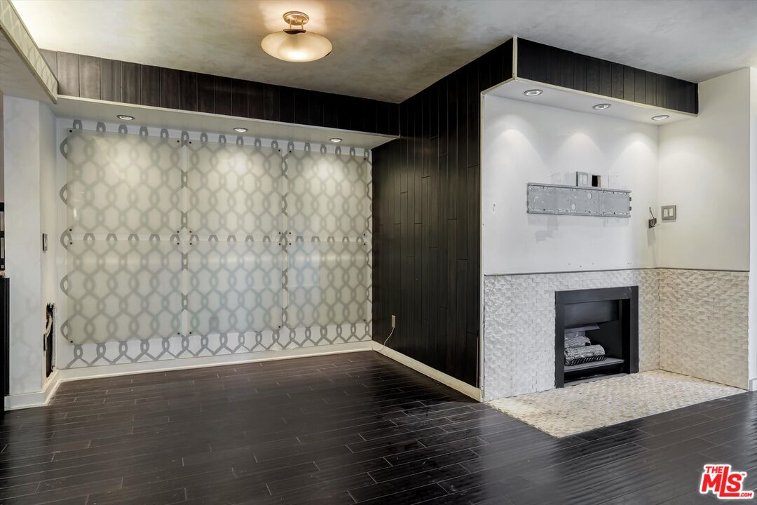 10590 Wilshire Boulevard, Unit 504 Los Angeles, CA 90024 - Photo 21 of 53 a view of empty room with wooden floor and fan