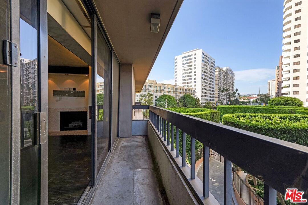 10590 Wilshire Boulevard, Unit 504 Los Angeles, CA 90024 - Photo 22 of 53 a view of a balcony with wooden floor