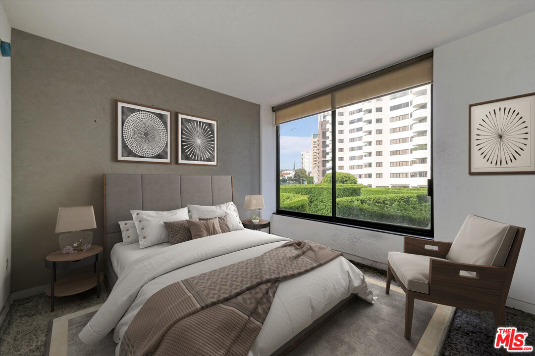 10590 Wilshire Boulevard, Unit 504 Los Angeles, CA 90024 - Photo 24 of 53 a bedroom with a bed and a large window