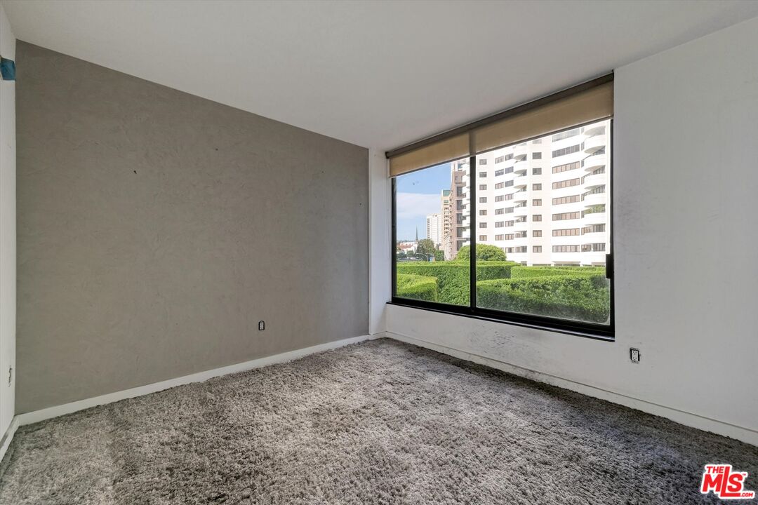 10590 Wilshire Boulevard, Unit 504 Los Angeles, CA 90024 - Photo 25 of 53 a view of an empty room with a window