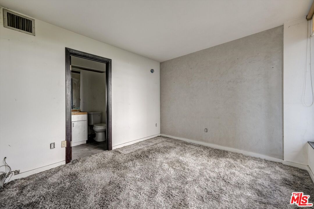 10590 Wilshire Boulevard, Unit 504 Los Angeles, CA 90024 - Photo 29 of 53 a view of an empty room and fire place