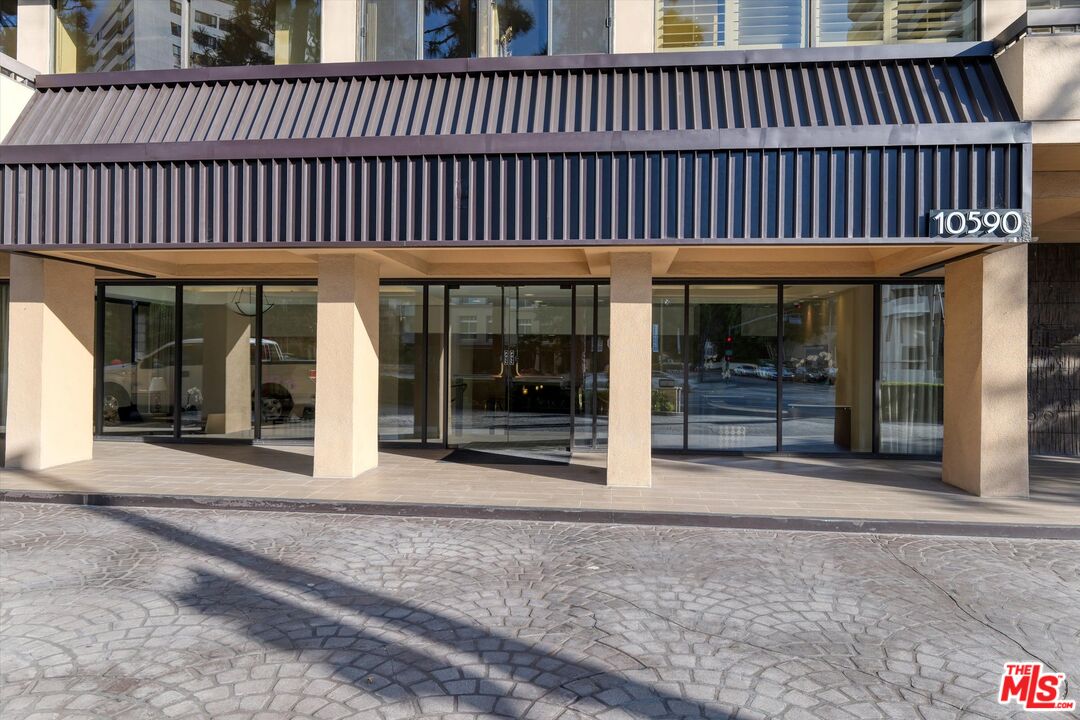 10590 Wilshire Boulevard, Unit 504 Los Angeles, CA 90024 - Photo 3 of 53 a view of a house with floor to ceiling window and wooden floor