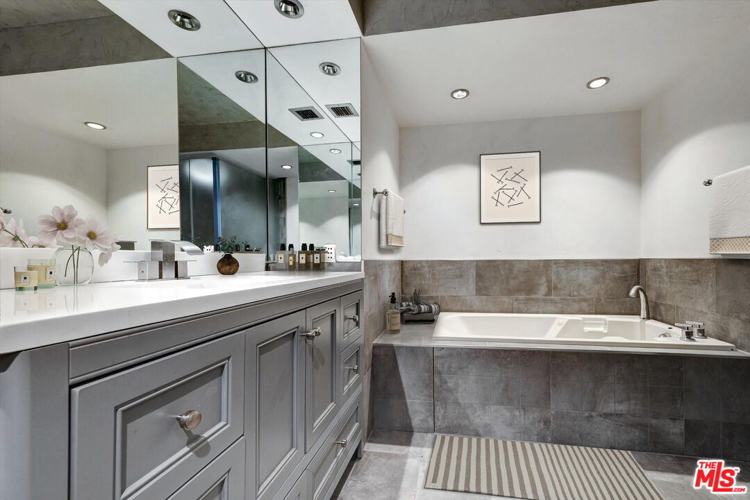 10590 Wilshire Boulevard, Unit 504 Los Angeles, CA 90024 - Photo 37 of 53 a kitchen with a sink and a refrigerator