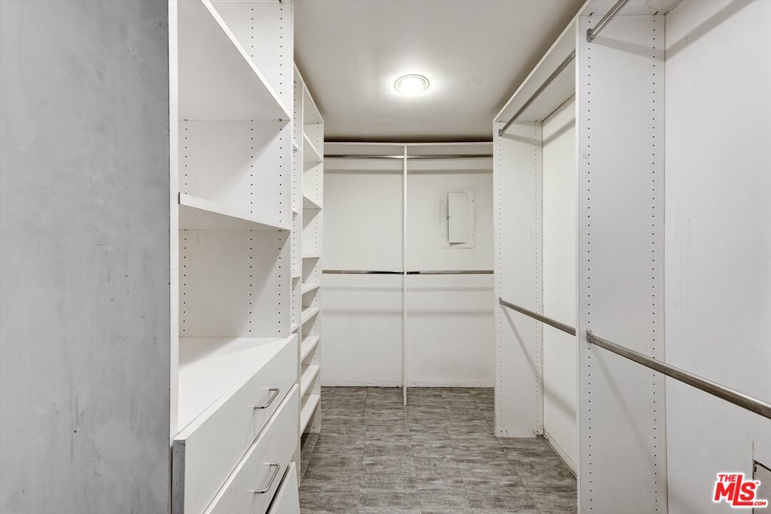 10590 Wilshire Boulevard, Unit 504 Los Angeles, CA 90024 - Photo 40 of 53 a view of walk in closet with white walls and door