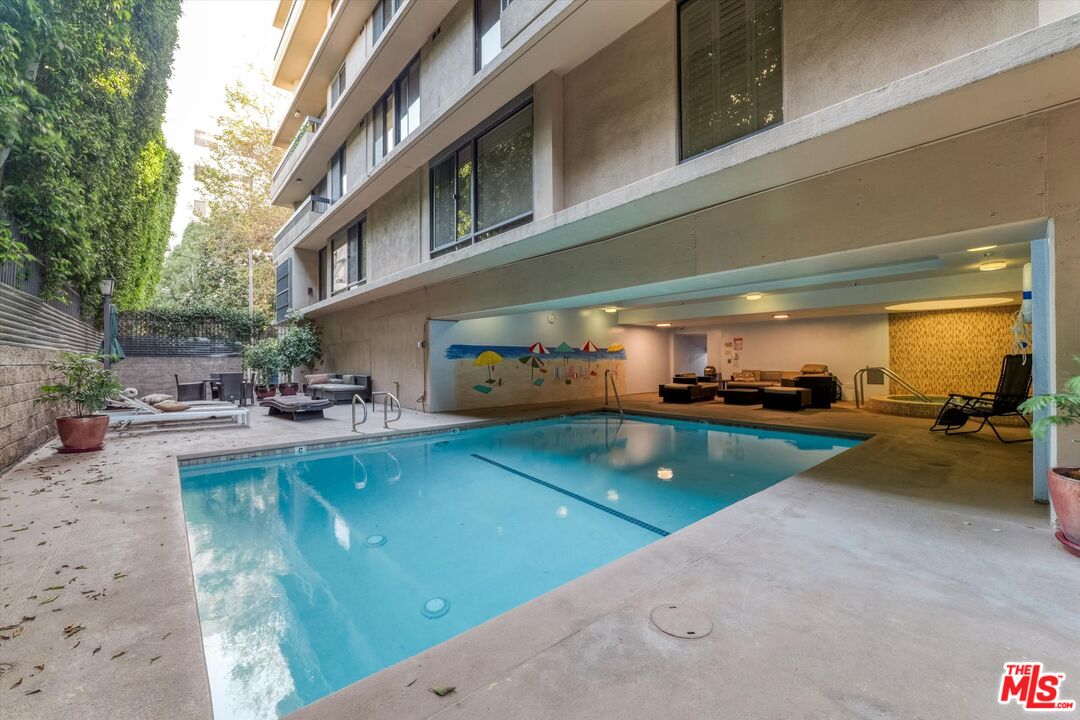 10590 Wilshire Boulevard, Unit 504 Los Angeles, CA 90024 - Photo 43 of 53 a view of a swimming pool with chairs
