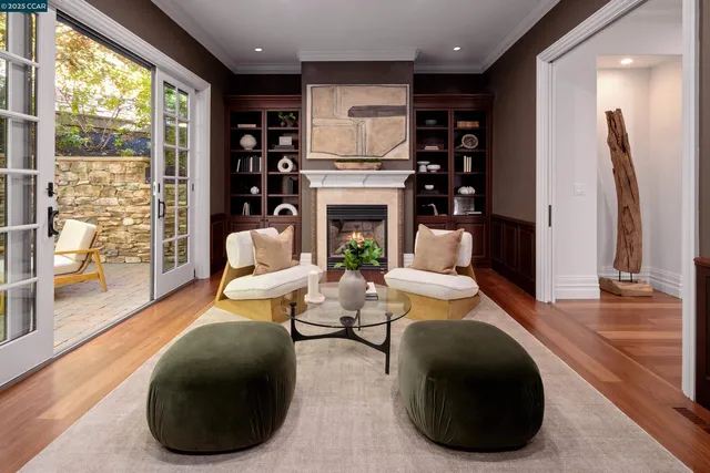 a living room with fireplace furniture and a fireplace