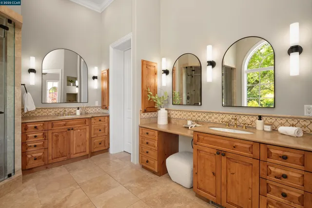 a bathroom with a granite countertop sink a mirror and a