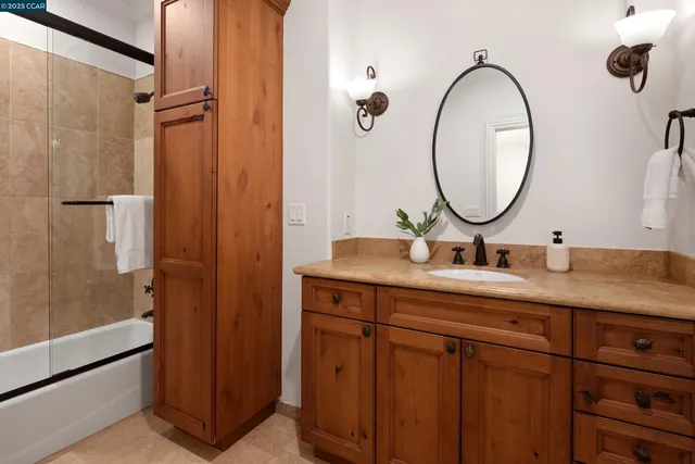 a bathroom with a double vanity sink and a mirror