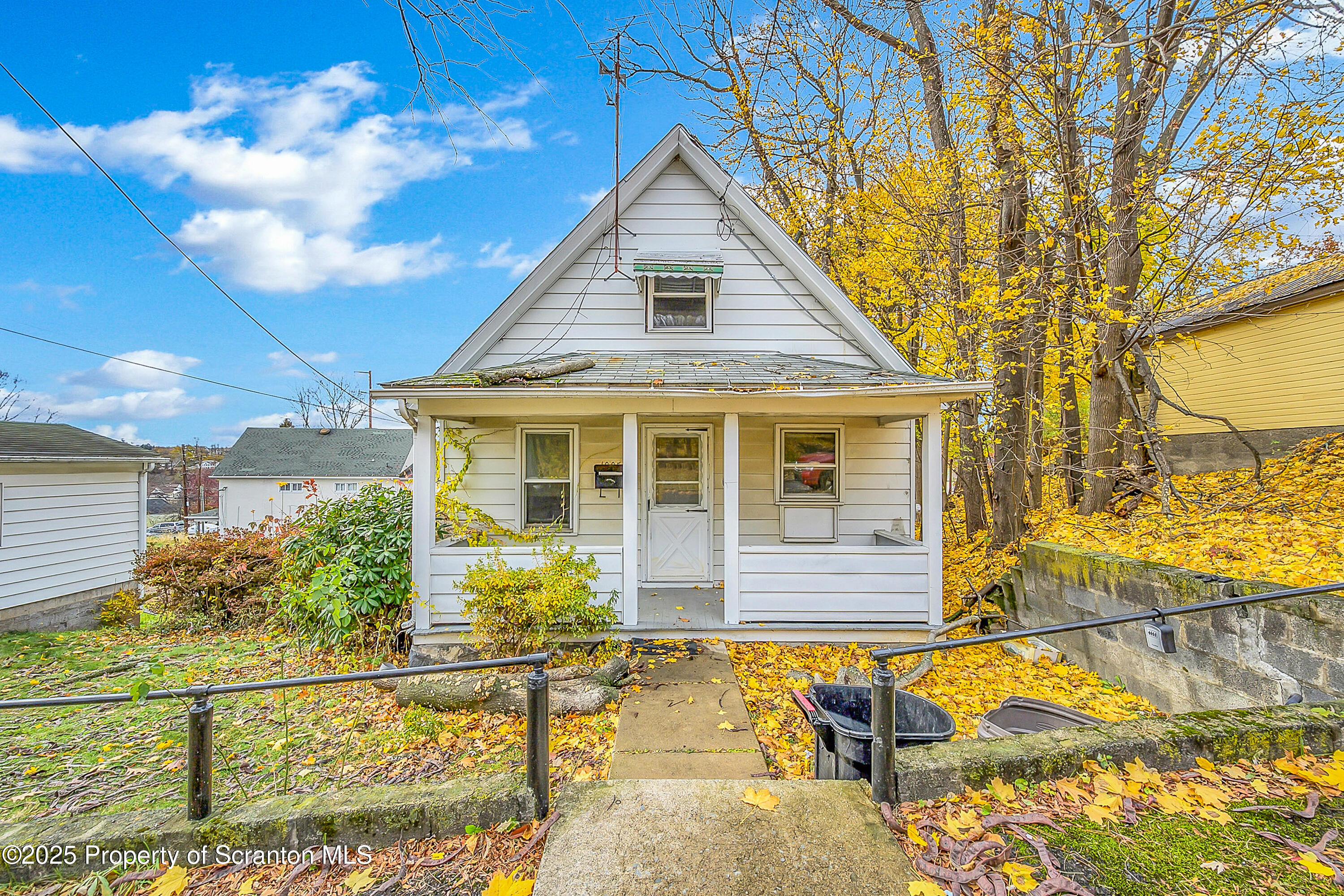 1005 Luke Avenue Scranton, PA 18510 - Photo 1 of 15 a front view of a house with a yard
