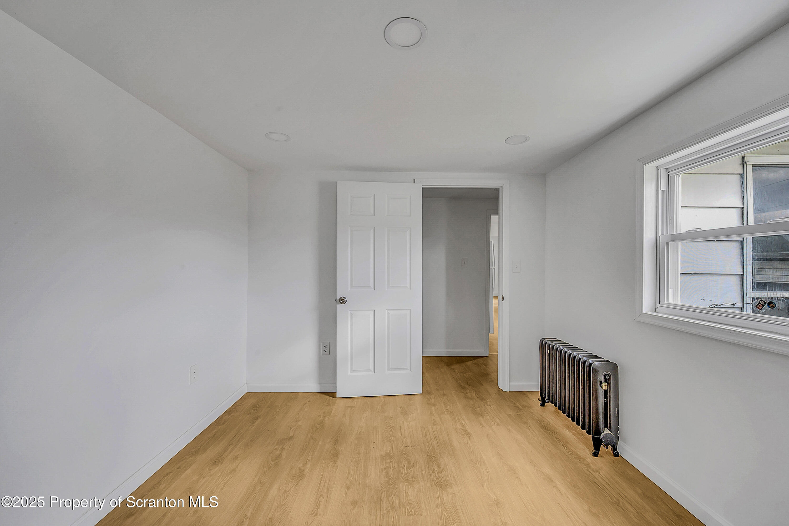 1005 Luke Avenue Scranton, PA 18510 - Photo 13 of 15 a view of livingroom with hardwood floor and workspace