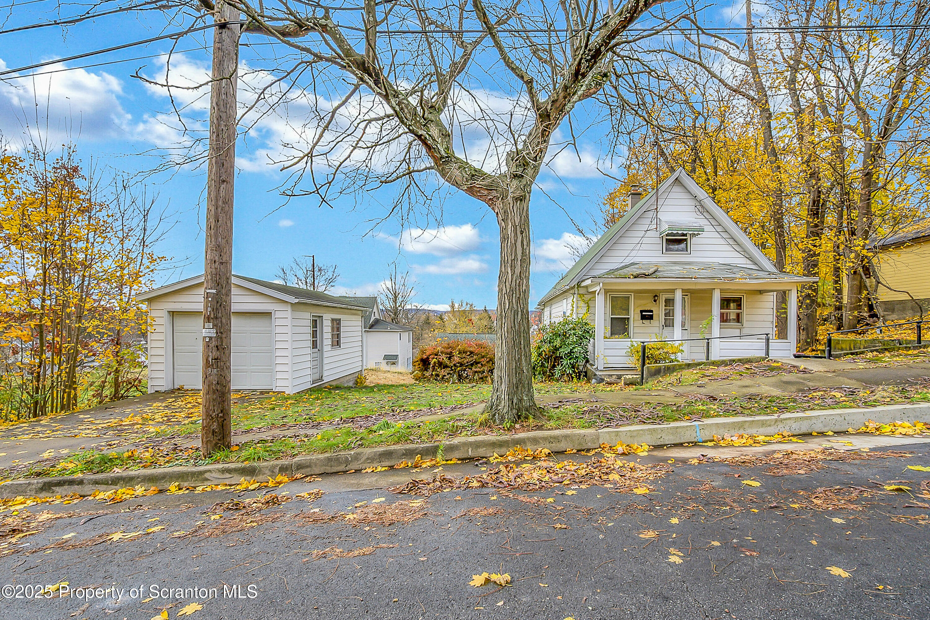 1005 Luke Avenue Scranton, PA 18510 - Photo 2 of 15 a front view of a house with a yard