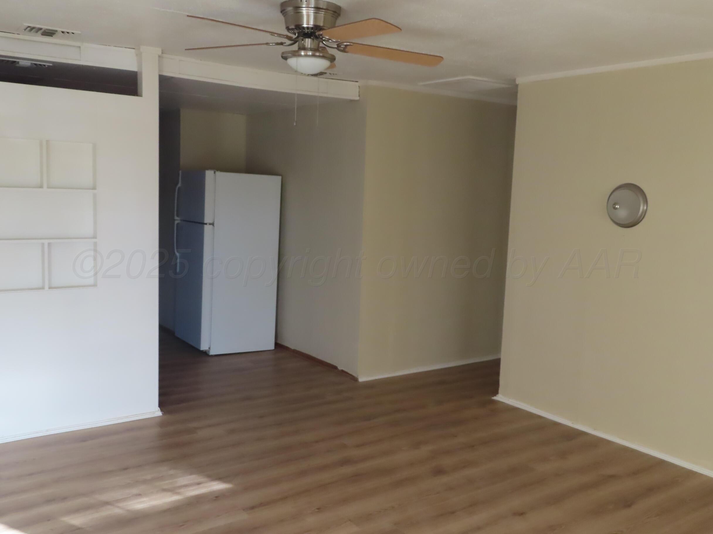 2500 Chestnut Street Amarillo, TX 79107 - Photo 2 of 8 wooden floor in an empty room