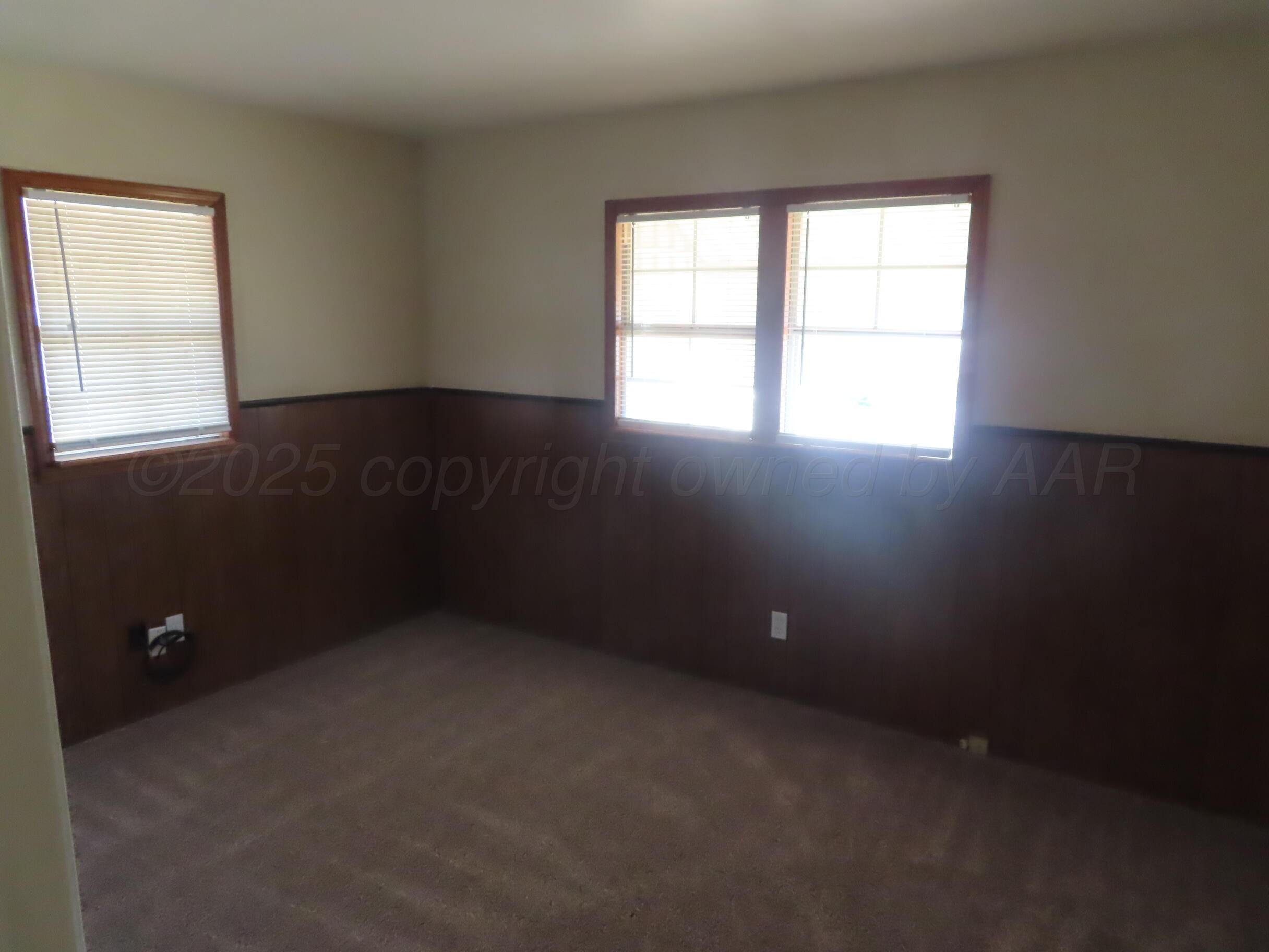 2500 Chestnut Street Amarillo, TX 79107 - Photo 6 of 8 an empty room with a window