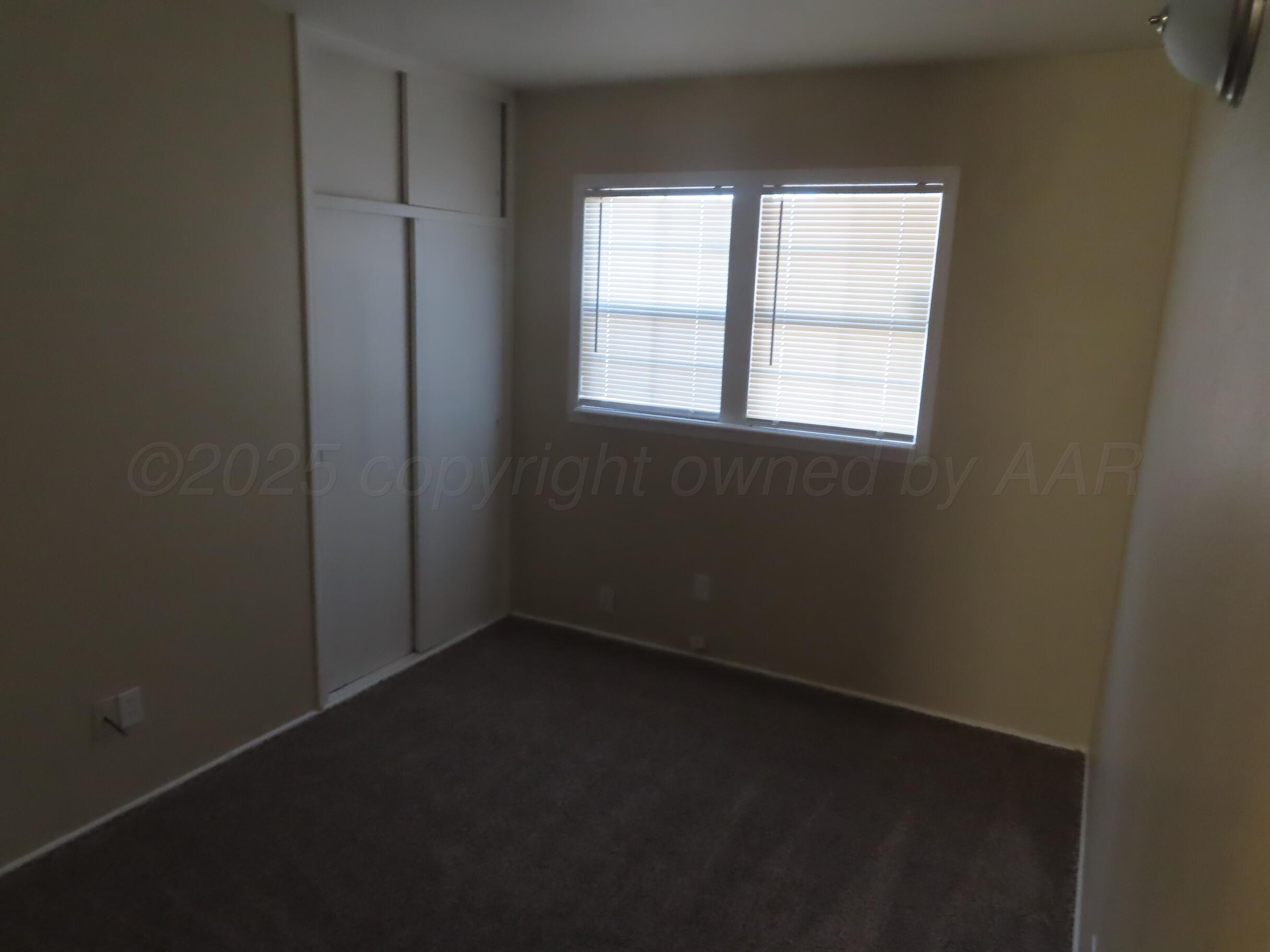 2500 Chestnut Street Amarillo, TX 79107 - Photo 8 of 8 an empty room with a window
