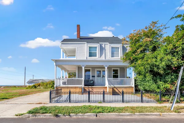 a front view of a house with a porch