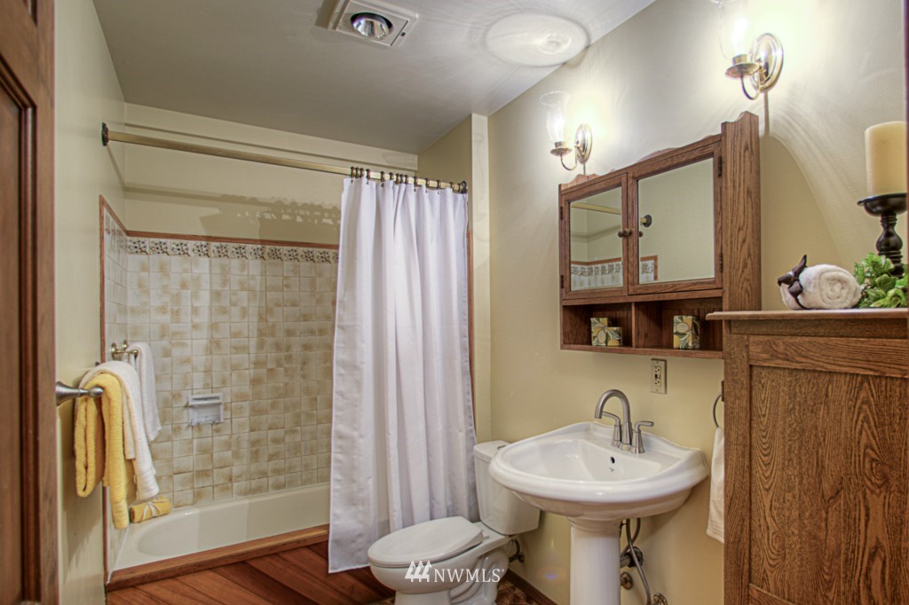 310 208th Street Southeast Bothell, WA 98012 - Photo 13 of 25 a bathroom with a sink toilet and shower