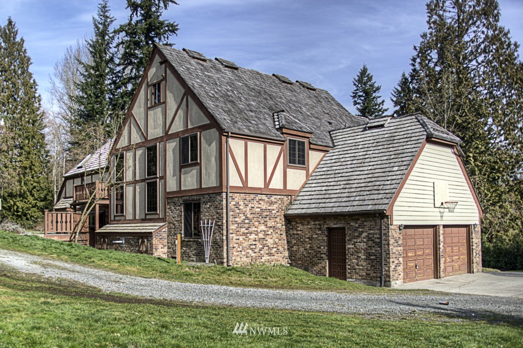 310 208th Street Southeast Bothell, WA 98012 - Photo 21 of 25 a front view of a house with a yard