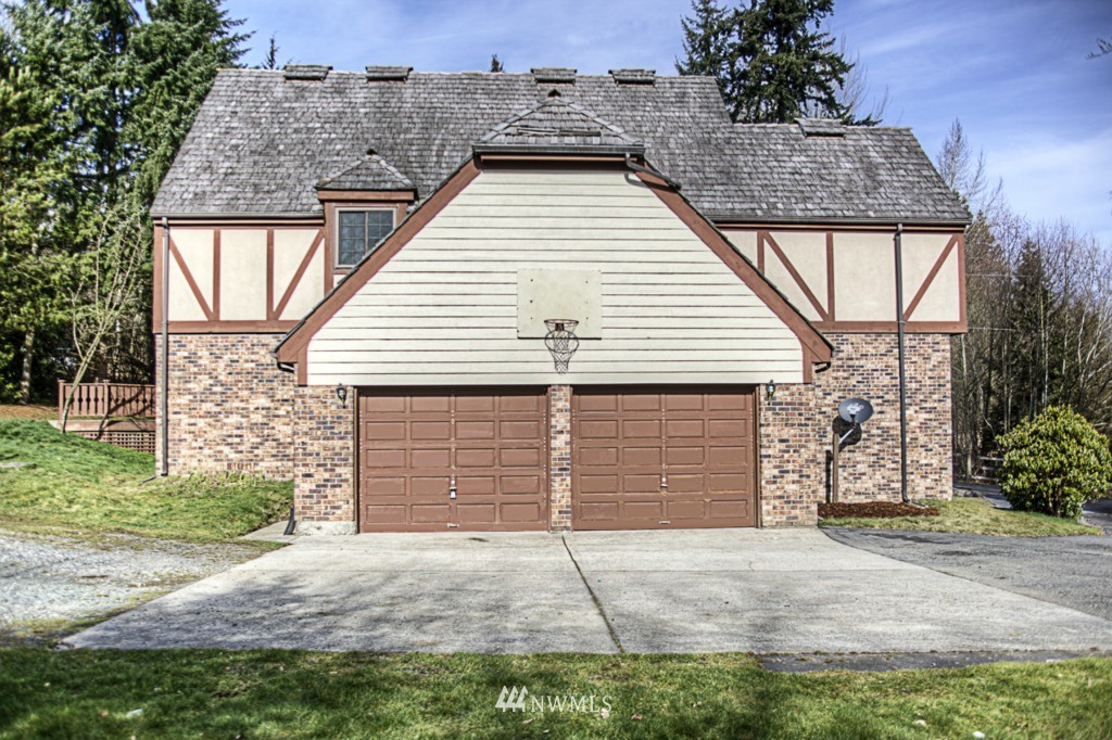 310 208th Street Southeast Bothell, WA 98012 - Photo 22 of 25 a view of a house with a outdoor space and garage