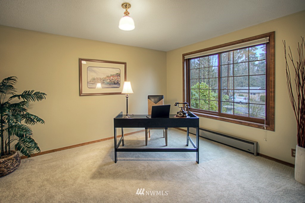 310 208th Street Southeast Bothell, WA 98012 - Photo 8 of 25 a living room with furniture and a window