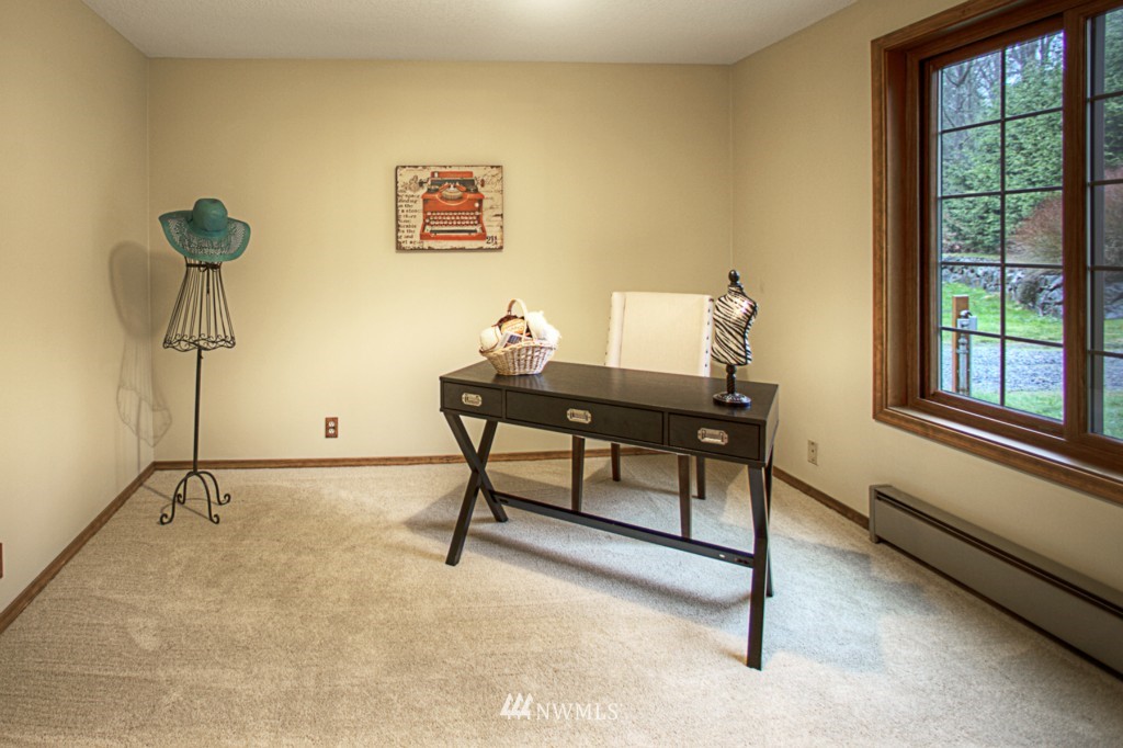 310 208th Street Southeast Bothell, WA 98012 - Photo 9 of 25 a view of a workspace with furniture and a window