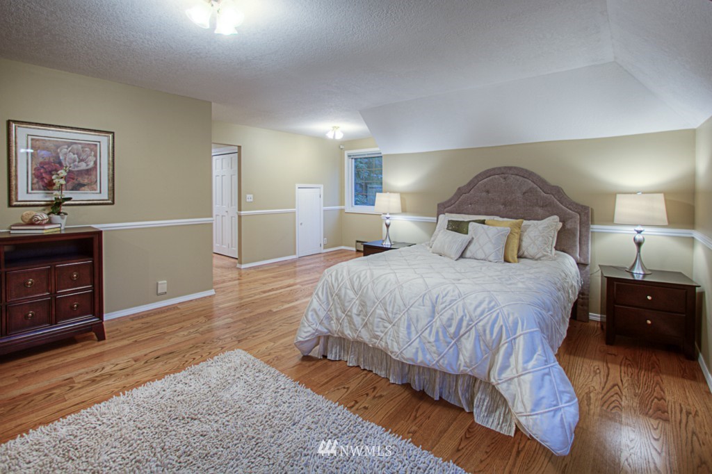 310 208th Street Southeast Bothell, WA 98012 - Photo 10 of 25 a bedroom with a bed and a dresser