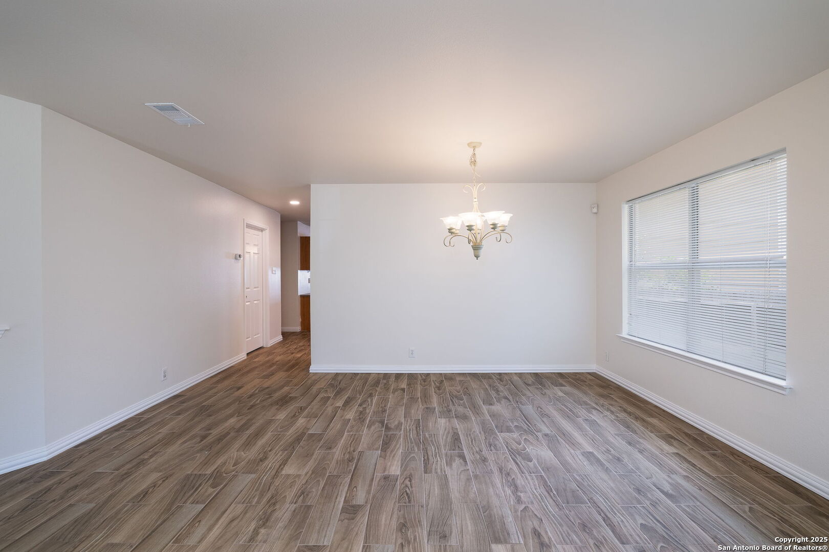 3617 Granite Schertz, TX 78154 - Photo 8 of 29 wooden floor in an empty room with a window