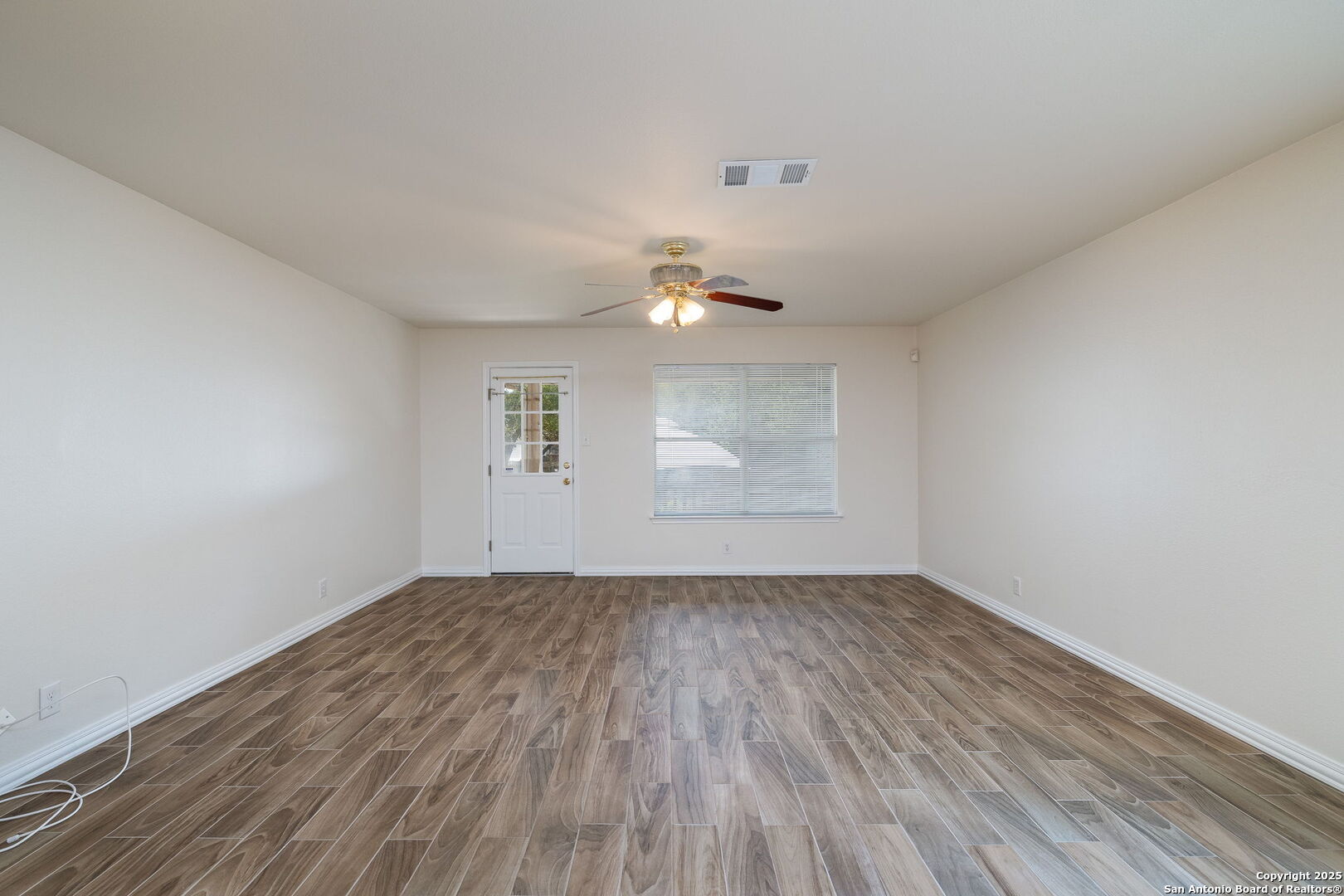 3617 Granite Schertz, TX 78154 - Photo 10 of 29 wooden floor in an empty room with a window