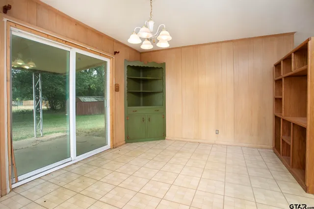 a view of an entryway with a chandelier
