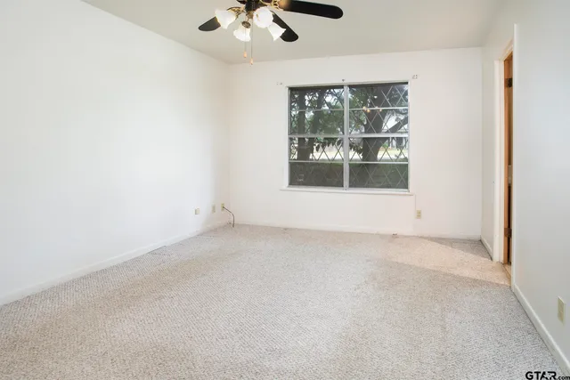 an empty room with a empty space and windows
