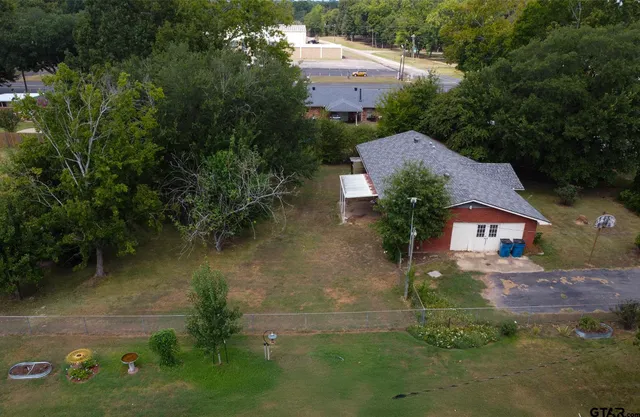 an aerial view of house with yard