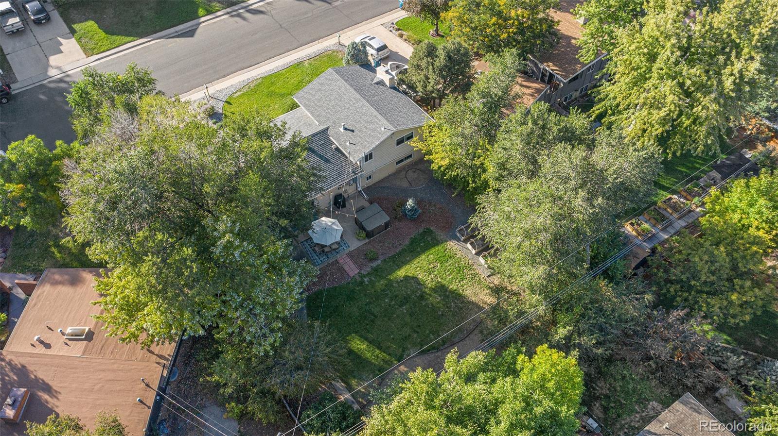 3582 Wright Street Wheat Ridge, CO 80033 - Photo 26 of 31 an aerial view of a house with a yard
