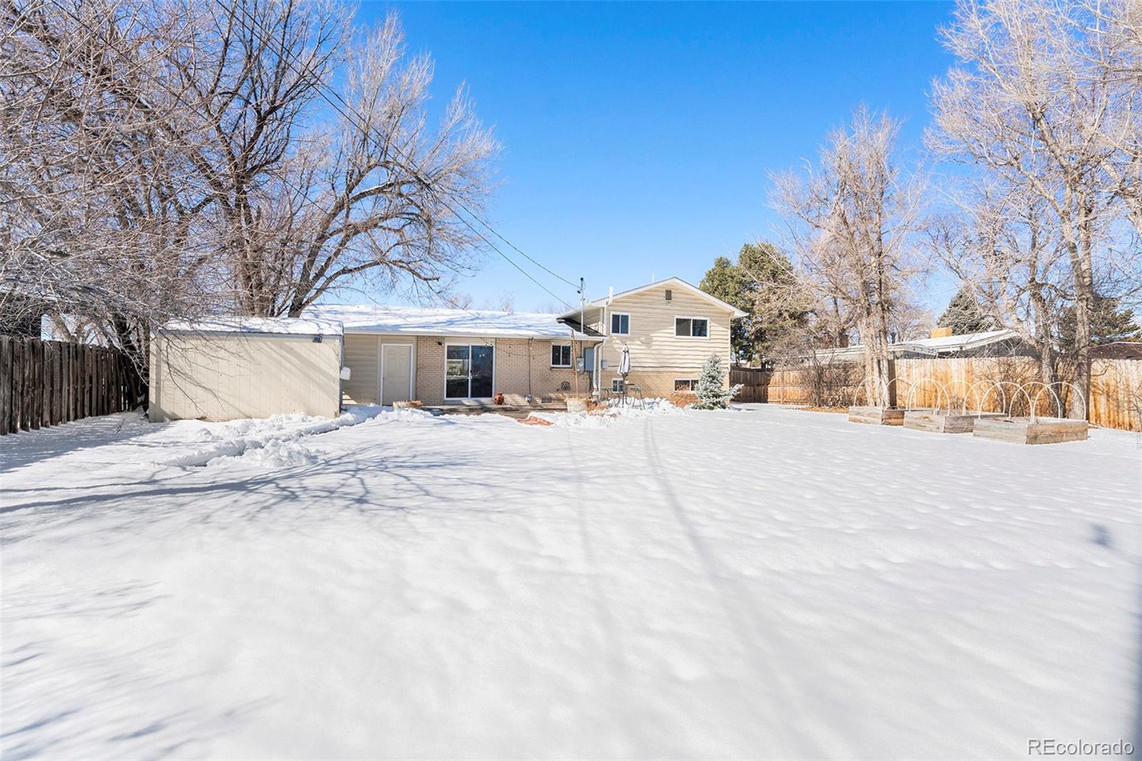 3582 Wright Street Wheat Ridge, CO 80033 - Photo 28 of 31 a view of house with snow on the road